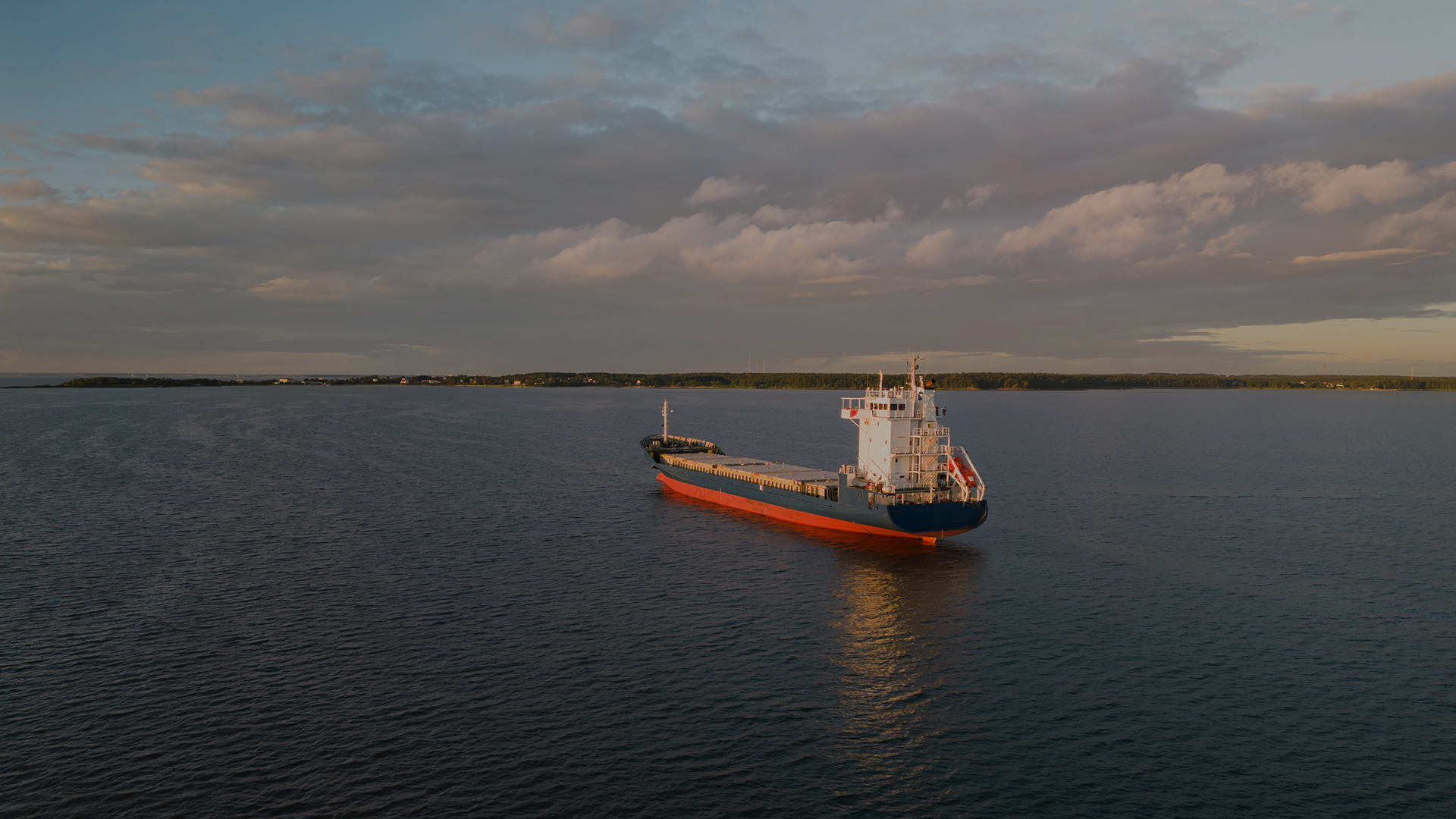 Unloaded cargo vessel in the Baltic sea off the coast of Estonia, photo view from a drone.